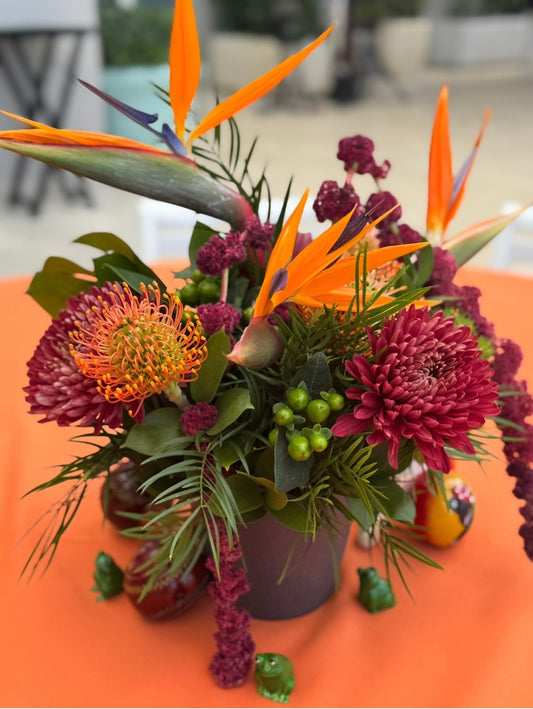 Autumn tropical centerpiece: birds of paradise, burgundy chrysanthemum, amaranth and pincushion protea