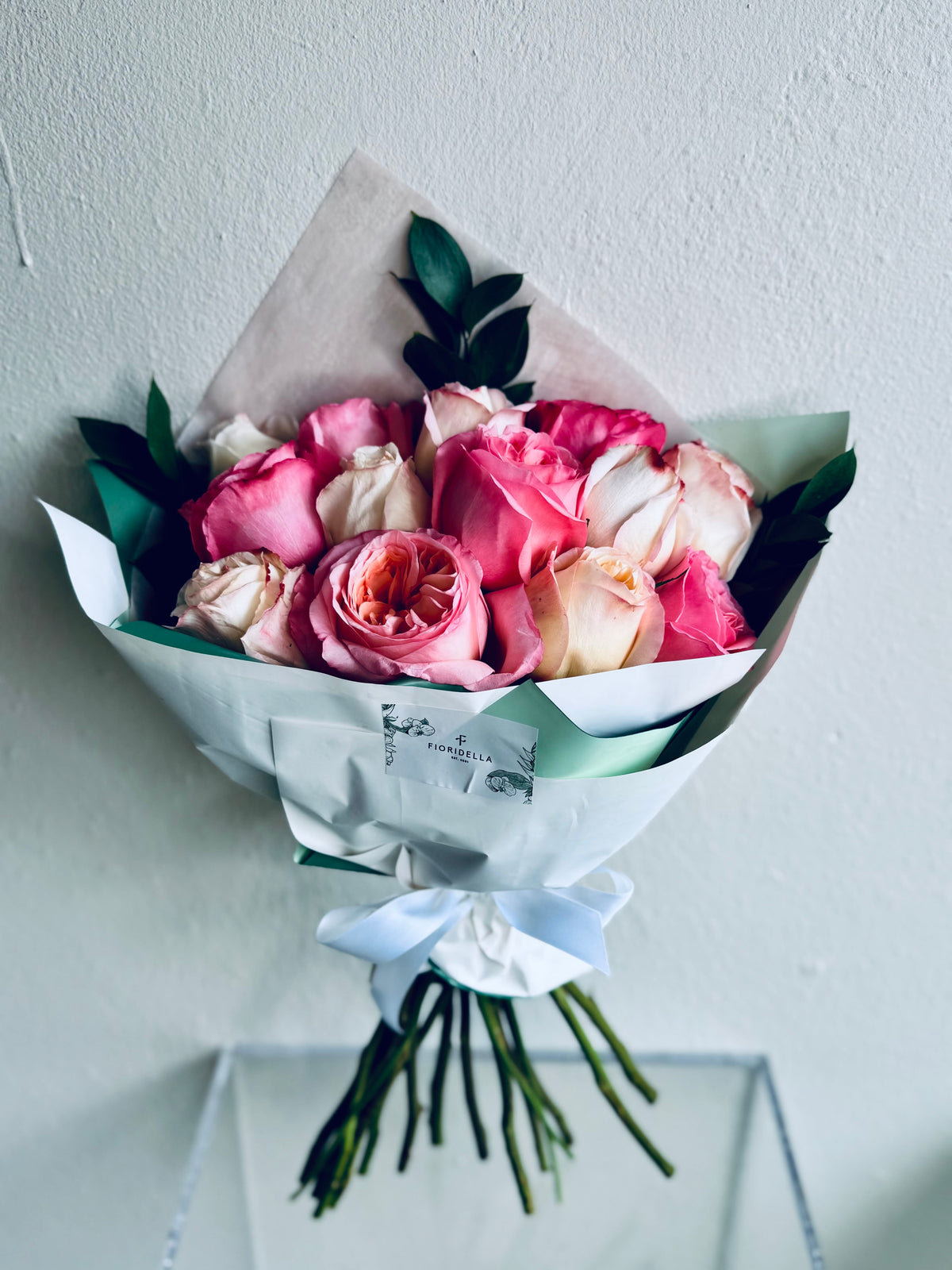 A dozen garden roses, hand-tied into a bouquet
