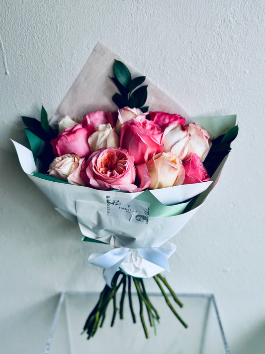 A dozen garden roses, hand-tied into a bouquet