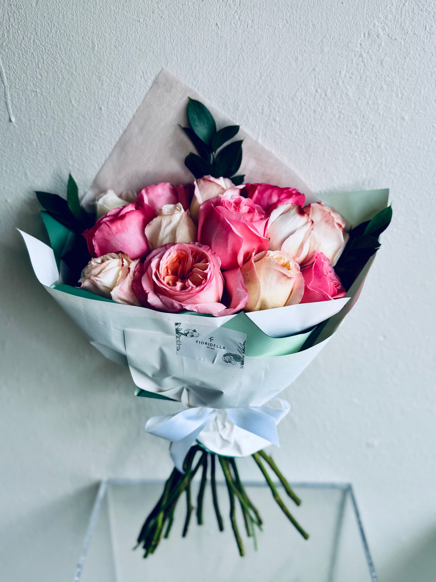 A dozen garden roses, hand-tied into a bouquet