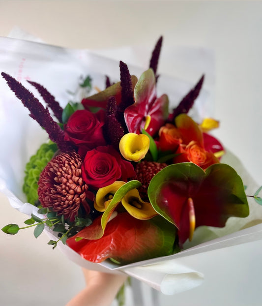 Autumn seasonal flowers hand-tied bouquet with red roses, anthuriums, yellow calla lilies and burgundy amaranth, Standard size